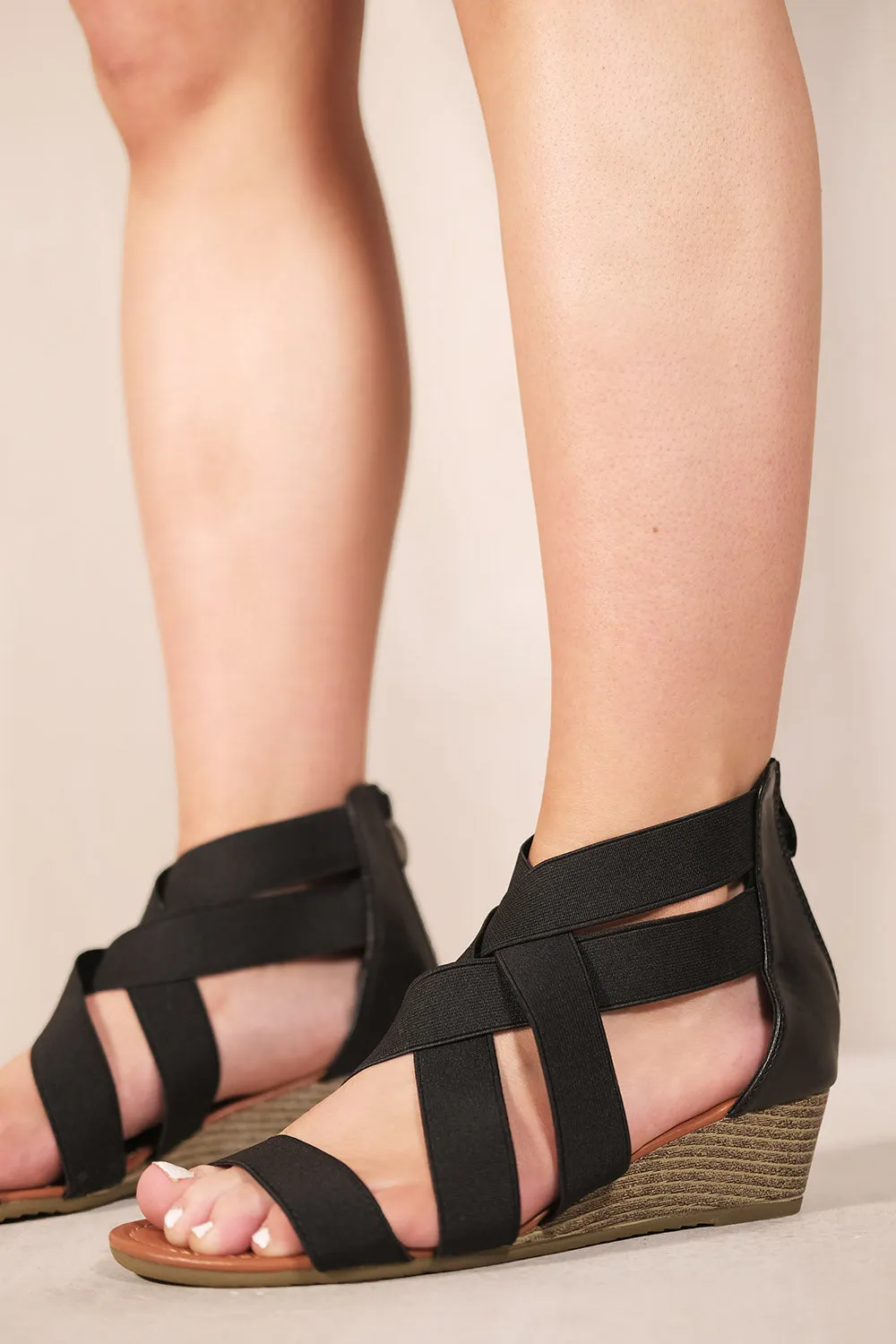 DALIRA LOW WEDGE HEEL STRAPPY SANDALS WITH REAR ZIP IN BLACK FAUX LEATHER